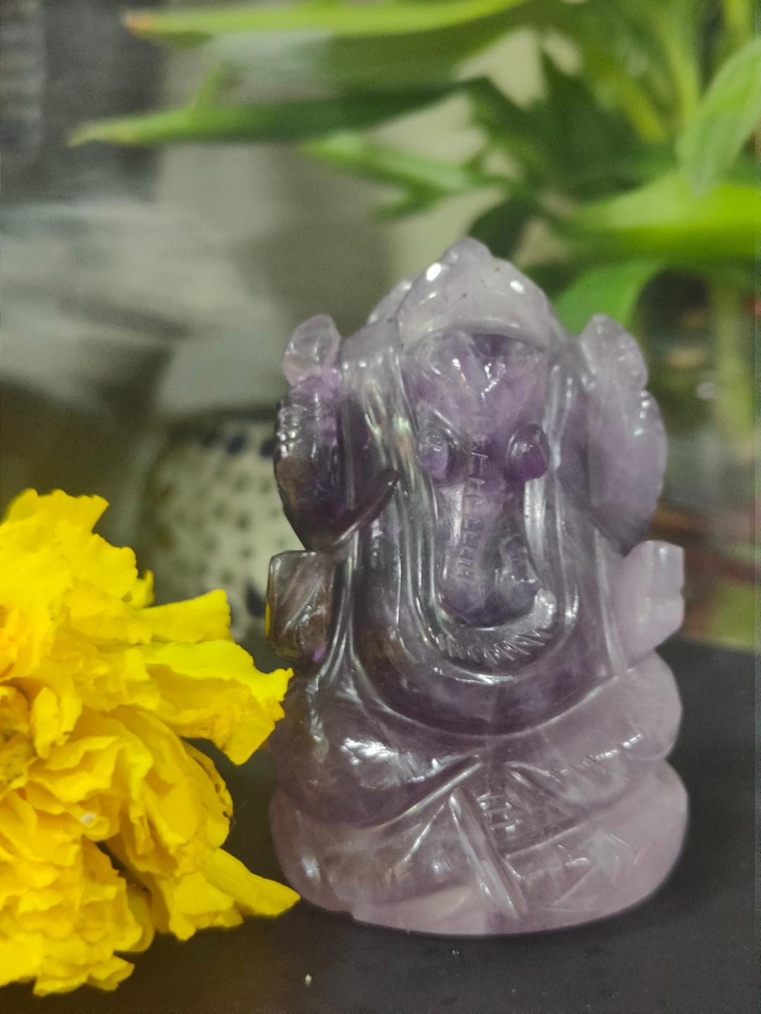Amethyst Ganesha Idol with marigold flowers