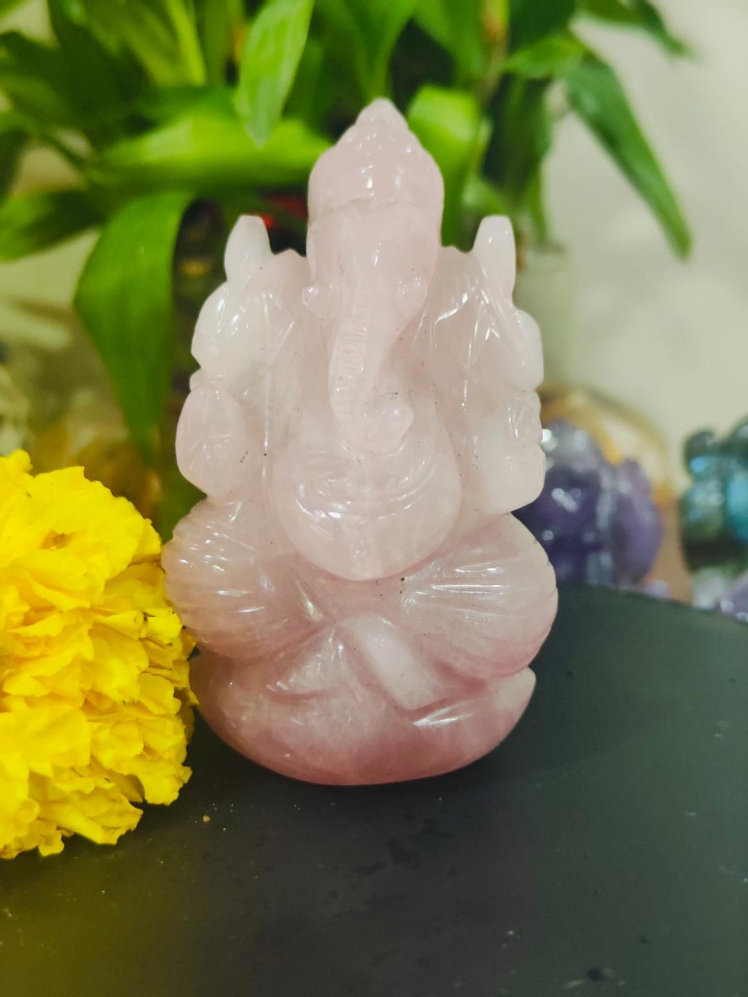 Rose Quartz Ganesha Idol with marigold flowers