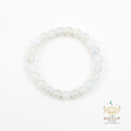 Rainbow Moonstone 8mm crystal bracelet flat lay on white background with SoulUp Store logo