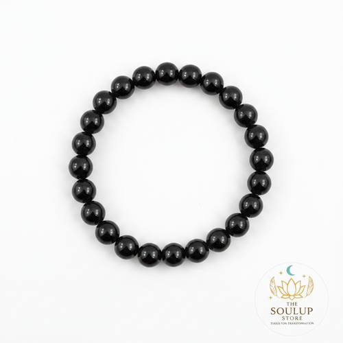 Black Tourmaline 8mm crystal bracelet flat lay on white background with SoulUp Store logo