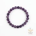 Amethyst 8mm crystal bracelet flat lay on white background with SoulUp Store logo