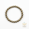 Pyrite 8mm crystal bracelet flat lay on white background with SoulUp Store logo